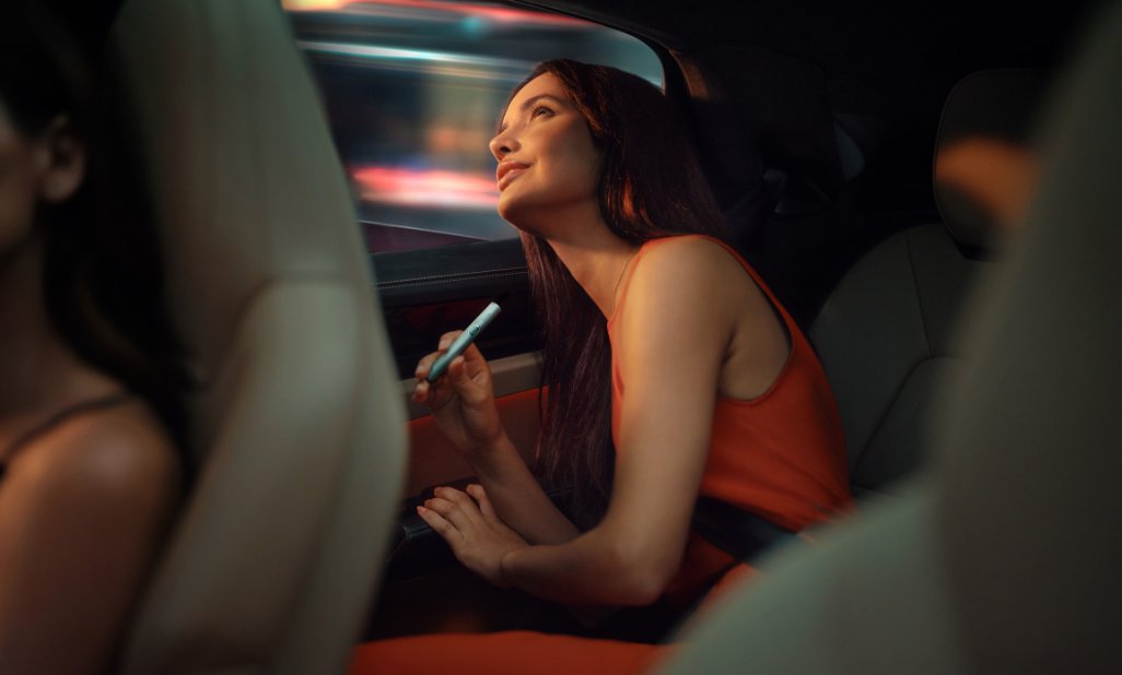  Image of phone with IQOS CLUB logo