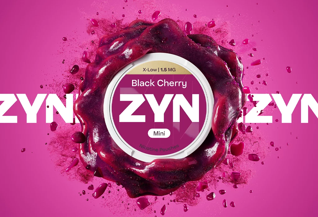 ZYN Black Cherry X-Low Mini nicotine pouches 1.5 mg on a cherry-inspired background