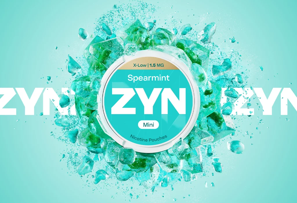 ZYN Spearmint Slim kutijica nikotinskih vrećica 1.5 mg okružena vizualom mente na svijetlozelenoj pozadini