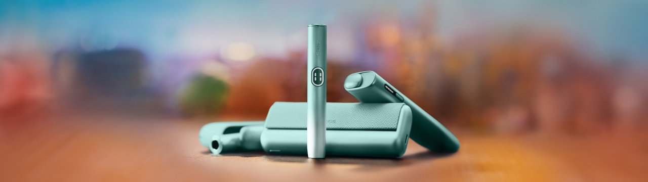 Three breeze blue ILUMA i devices displayed vertically on turquoise background.