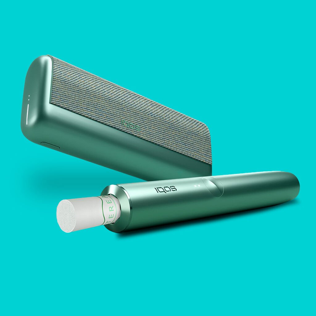 A Jade Green IQOS ILUMA PRIME Holder and Pocket Charger.