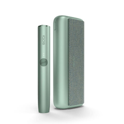 A jade green IQOS ILUMA PRIME device and holder.