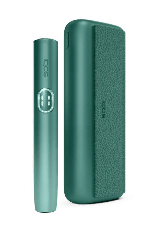 IQOS ILUMA i PRIME color verde con holder, sobre fondo verde claro.