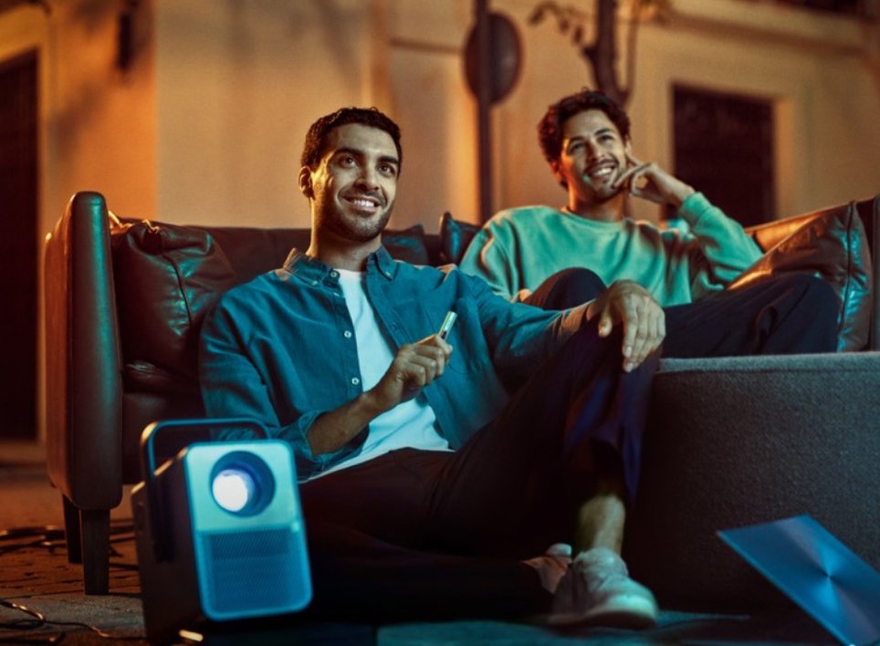 Male riding in a blue car