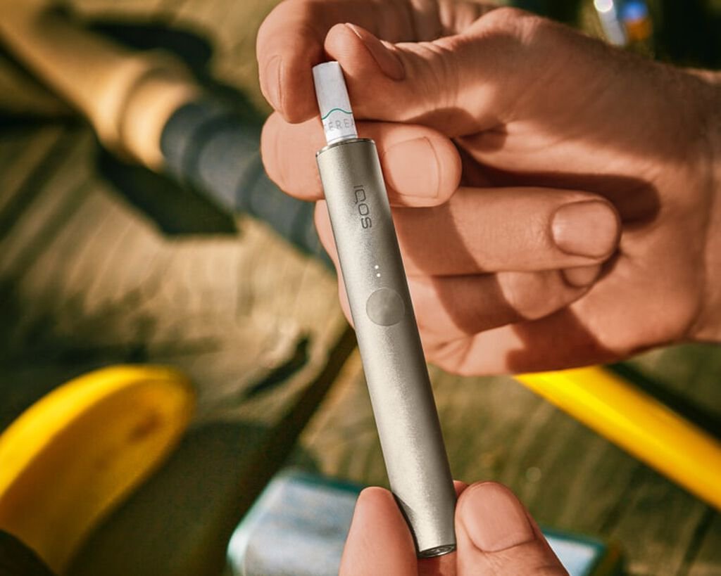 A pebble gray IQOS ILUMA device.