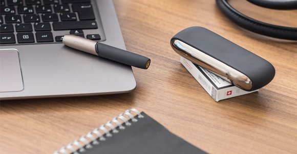 Black IQOS 3 on a working desk