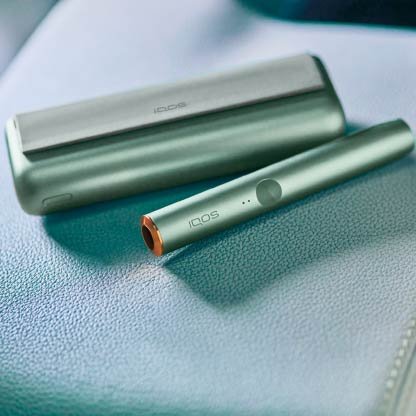 Stellar blue and white IQOS 3 DUO holders and chargers on a table together