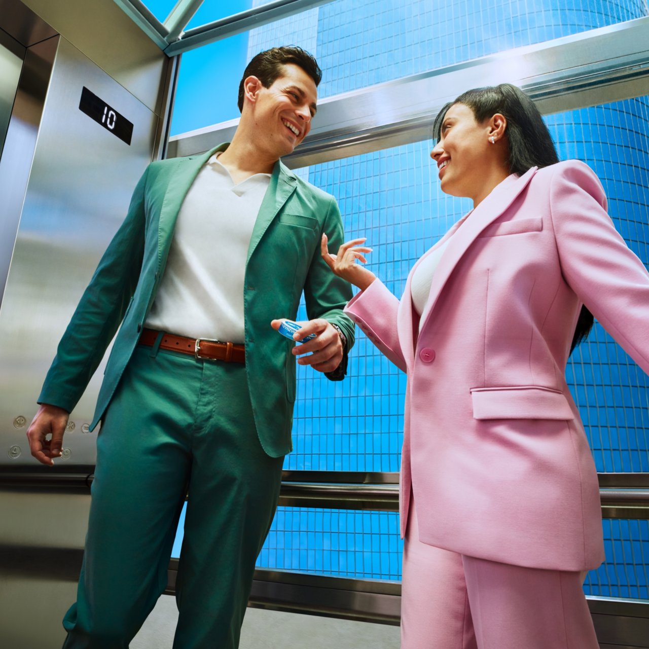 Two people discussing in the elevator