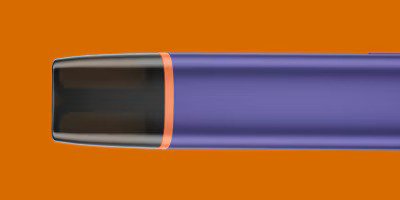 VEEV ONE vape uređaj na narančastoj pozadini