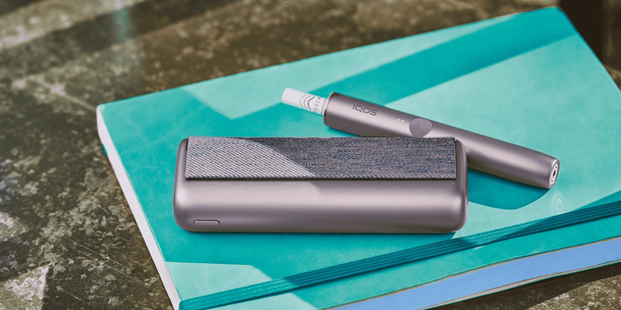IQOS ILUMA Prime auf einem Notizblock