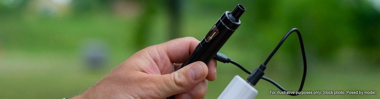  Man charging a vape