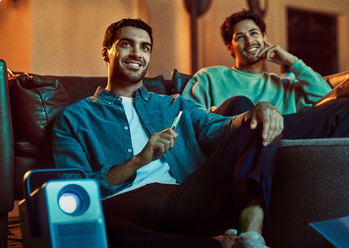  Two male friends sitting on a couch
