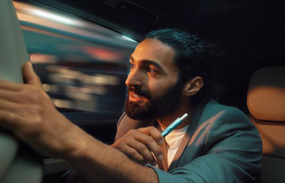  Image of phone with IQOS CLUB logo