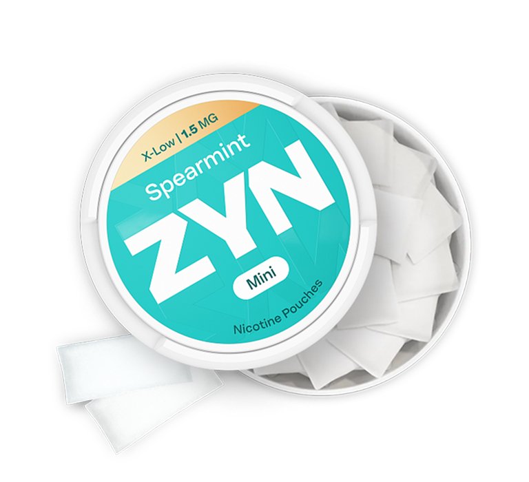 Offene Dose ZYN MINI Spearmint X-Low mit Nikotinbeutel daneben.