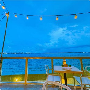 Night patio with lights by the ocean