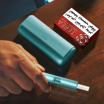 IQOS ILUMA on a notebook