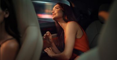 A man holding an IQOS box.