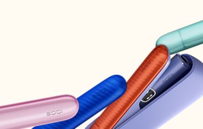 Устройство IQOS ILUMA с крышками разных цветов