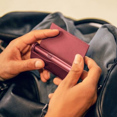 hand holding red device