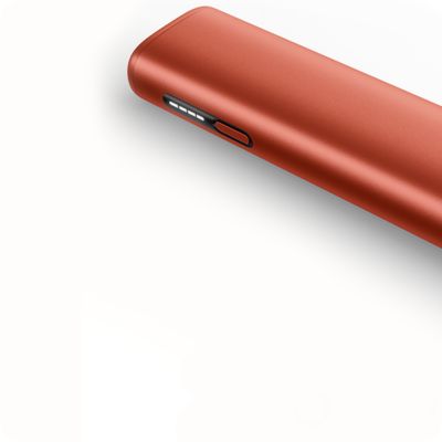 Detail zařízení IQOS ILUMA ve oranžové barvě