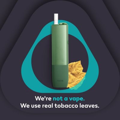 IQOS ILUMA One device on the IQOS key logo with caption: We’re not a vape. We use real tobacco leaves.