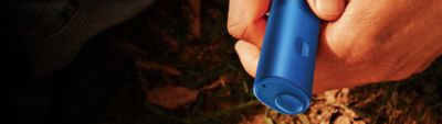 Hands holding a blue BONDS 2 by IQOS device