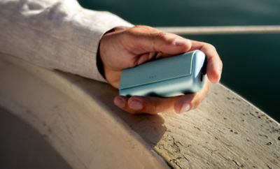 A man with an IQOS box.