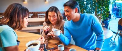 Three friends enjoying coffee together