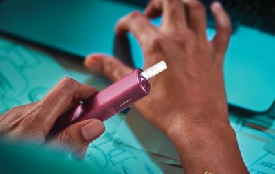 A TEREA stick in an IQOS ILUMA One held in hand