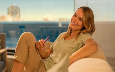 How do I check how many uses I have left with my IQOS?