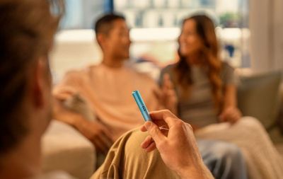 Can I use cigarettes or tobacco sticks from other brands on an IQOS device?