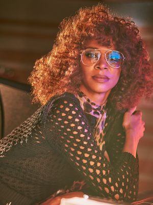 A  group of friends, one using an IQOS device.