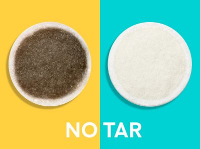 Cigarette filter with brown combustion stains compared to IQOS HEETS stick in IQOS 3 DUO holder with no equivalent stain.