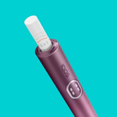 A Moss Green IQOS ILUMA with a TEREA stick inserted.