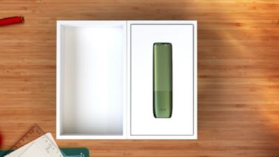 IQOS ILUMA ONE dans une boîte.