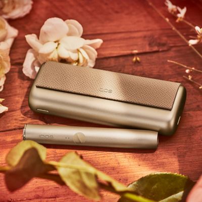 An IQOS ILUMA PRIME Holder and Pocket Charger.