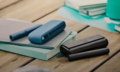 Two IQOS ILUMA devices.