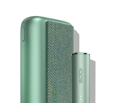 A Jade Green IQOS ILUMA PRIME Pocket Charger and Holder.