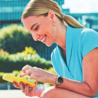 A person inserts a TEREA stick into an IQOS ILUMA ONE.