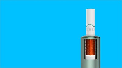 A Moss Green IQOS ILUMA with a TEREA stick inserted. 