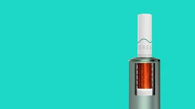 A Jade Green IQOS ILUMA PRIME with a TEREA stick inserted. 