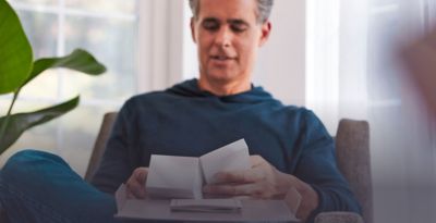 A man with an IQOS box.
