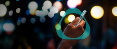 A Jade Green IQOS ILUMA PRIME Procket Charger and Holder on a DJ's turntable.