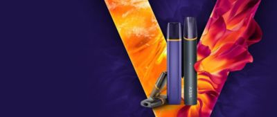 Two VEEV vaping devices on a red and orange V logo and violet background