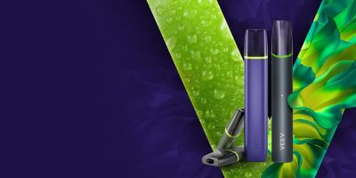 Two VEEV vaping devices on a red and orange V logo and violet background