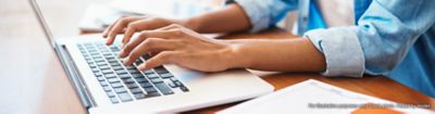 Woman typing on laptop