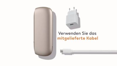 Woman with a golden IQOS holder and charger in her hand