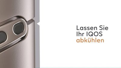 Woman with a golden IQOS holder and charger in her hand