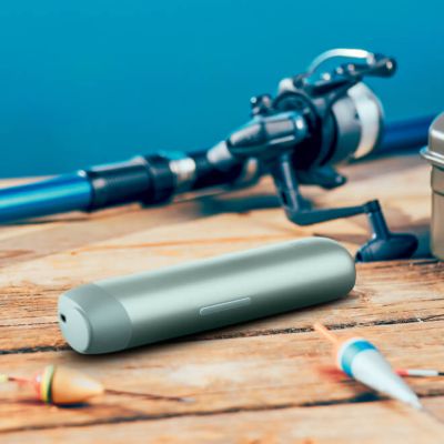 Hands holding lil SOLID Ez device and fishing gear