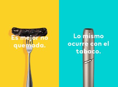 Burnt sausage on a fork compared to a clean IQOS HEETS stick in IQOS 3 DUO holder.